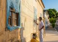 Quanto um pintor cobra para aplicar textura projetada na fachada de uma casa de 120 m² em 2026?