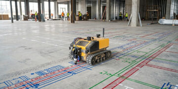 Levando os dados do projeto em 3D para o chão do canteiro de obras, o robô da Dusty faz a marcação física dez vezes mais rápido que uma equipe